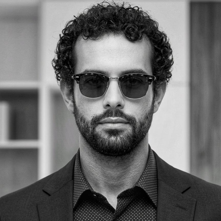 Professional monochrome headshot of Ben Moataz